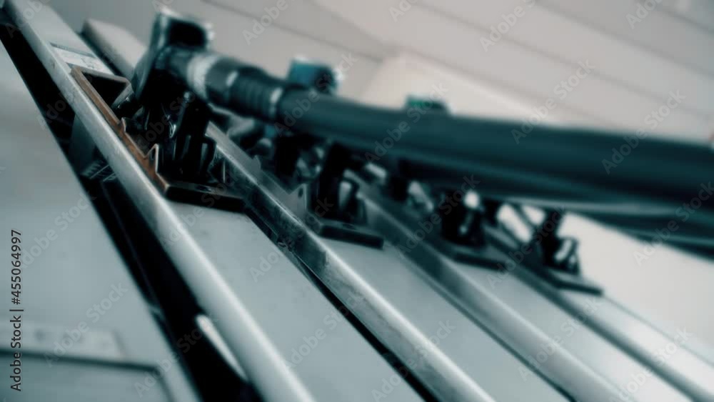 Placing the refueling gun on the rack of a gas station, close-up shot Placing the refueling gun on the rack of a gas station, close-up shot