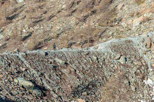 Detail of the steep mountain route beside the blu lake in Val D'Ayas on the Mount Rose in Northern Italy photo