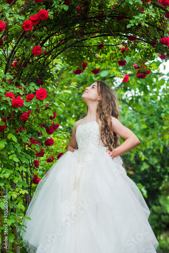 Gorgeous bridesmaid fashionable girl white dress roses garden, holidays concept