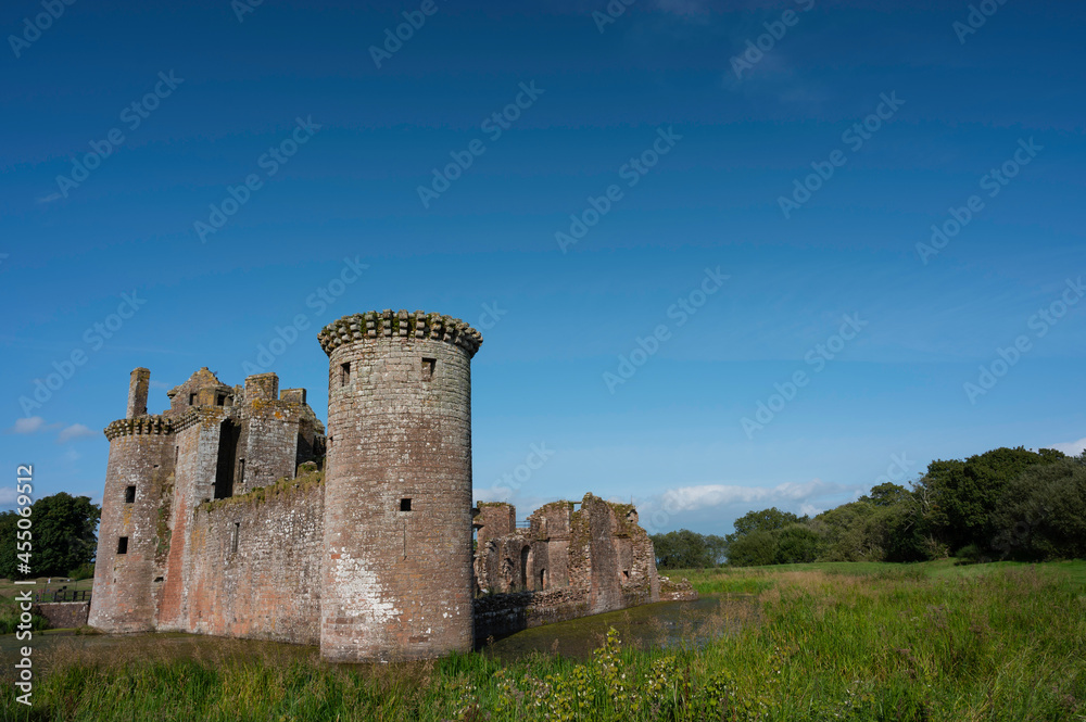 Caerlaverock Castle, Dumfries and Galloway, Scotland, in sunshine with blue sky, no people. Lots of copy space above in sky area.