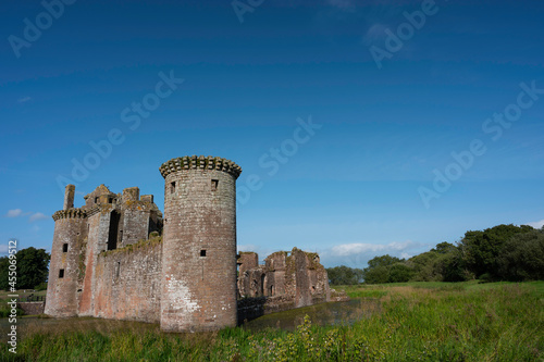 Caerlaverock Castle, Dumfries and Galloway, Scotland, in sunshine with blue sky, no people. Lots of copy space above in sky area. photo