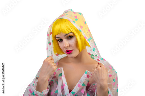 Portrait of woman wearing yellow wig isolated on white background