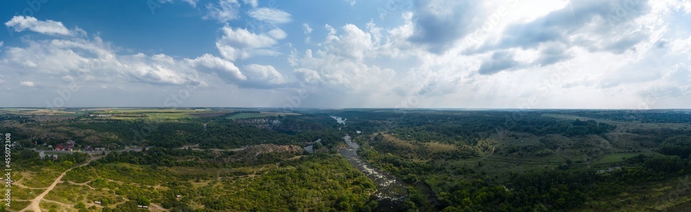 Landscape of the river and granite rocks aerial panorama view. Radon Lake in Migiya Ukraine