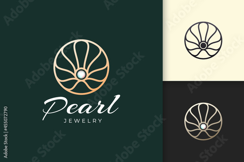 Luxury pearl logo in abstract and circle shape represent jewelry or beauty