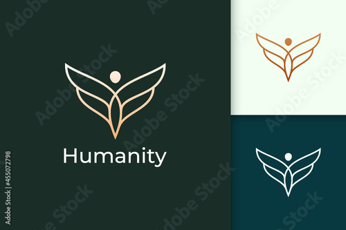 Luxury freedom logo in human and wing represent humanity or peace