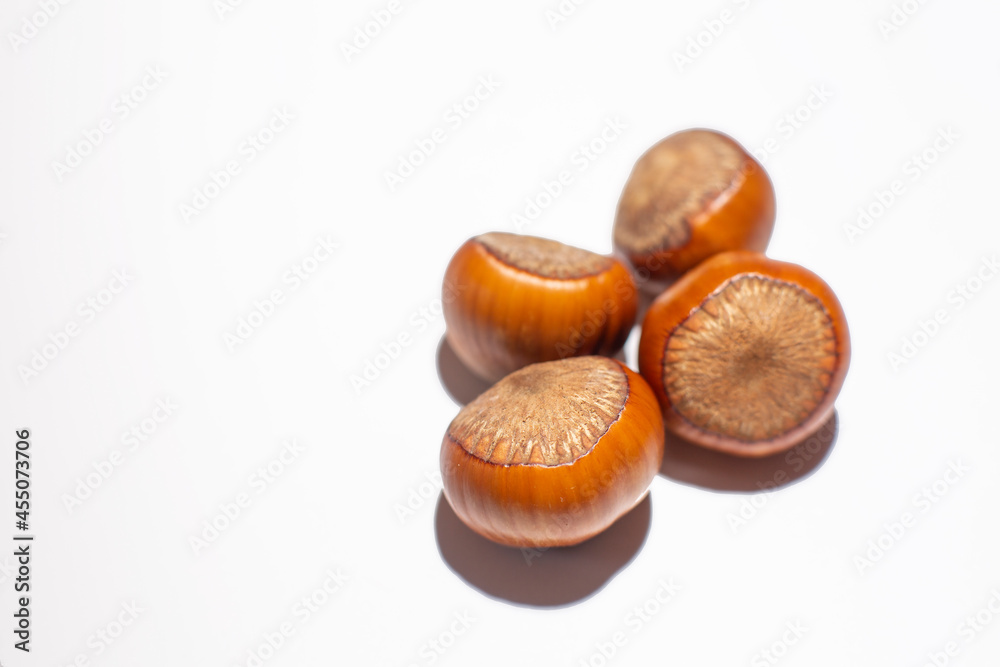 Nuts in shell, hazelnuts on a white background. heap or pile of nuts. Nuts background, healthy food Nuts in shell, hazelnuts on a white background. heap or pile of nuts. Nuts background, healthy food