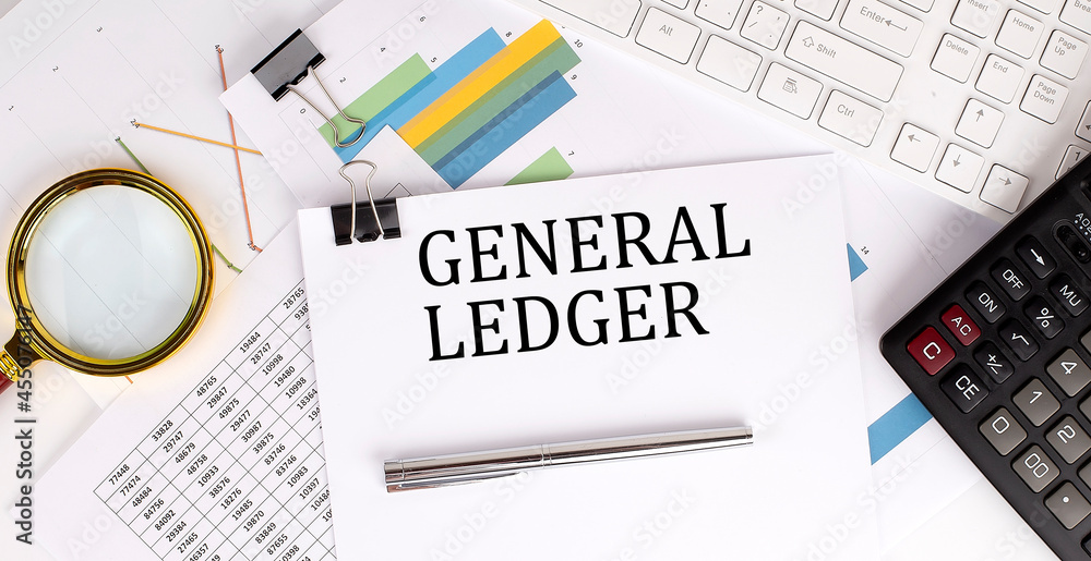 Obraz premium GENERAL LEDGER text on the white paper on the light background with charts paper ,keyboard and calculator