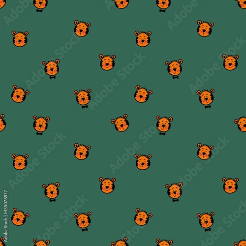 Seamless pattern with cute tiger cubs. Design for children's clothing, fabrics and other items. The illustration is hand-drawn with live lines in the kartun style.
