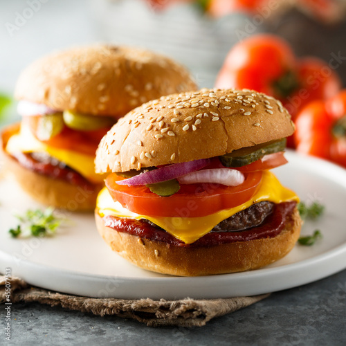 Traditional homemade cheeseburgers on a plate