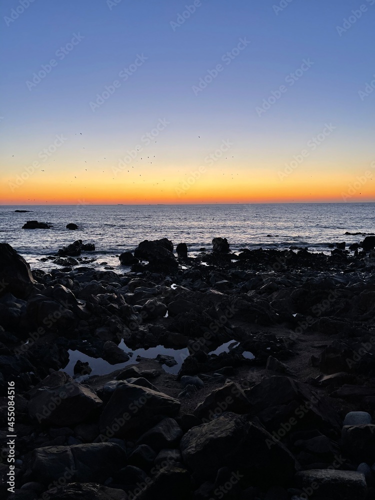 Sunset, rocks and sea breeze