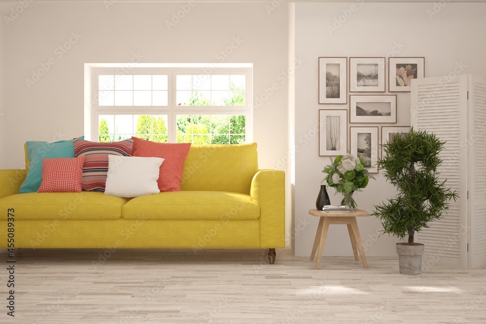 Fototapeta premium White living room with sofa and summer landscape in window. Scandinavian interior design. 3D illustration