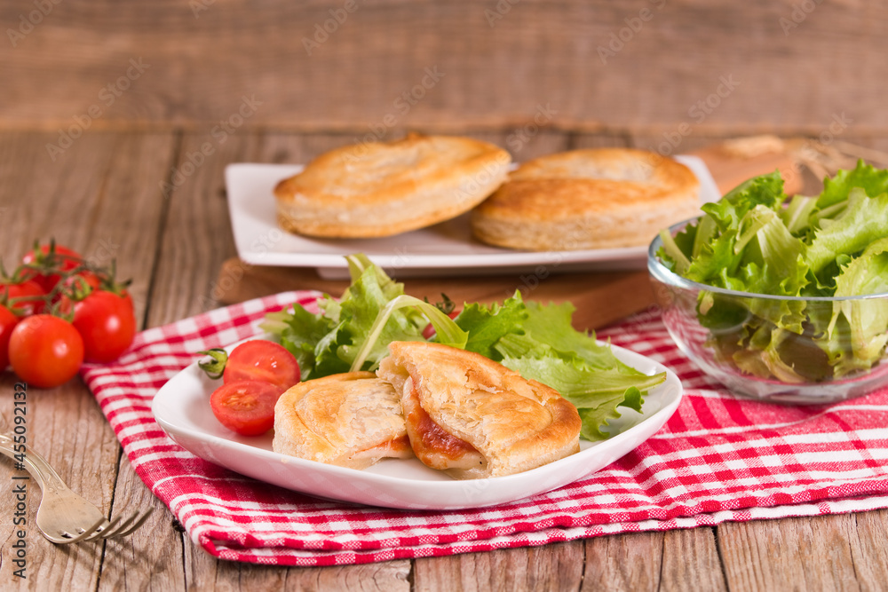 Puff pastry filled with tomato and mozzarella cheese.