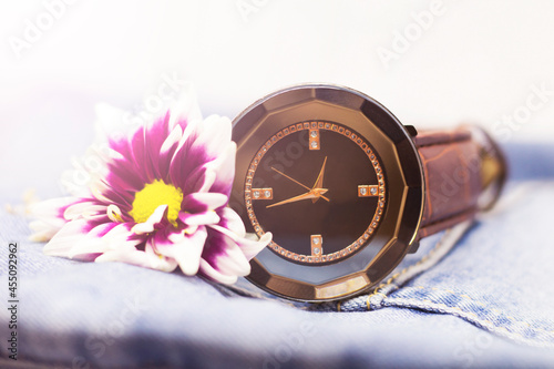 Wristwatches and lilac chrysanthemum