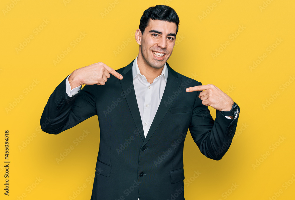 Handsome hispanic man wearing business clothes looking confident with smile on face, pointing oneself with fingers proud and happy. Handsome hispanic man wearing business clothes looking confident with smile on face, pointing oneself with fingers proud and happy.