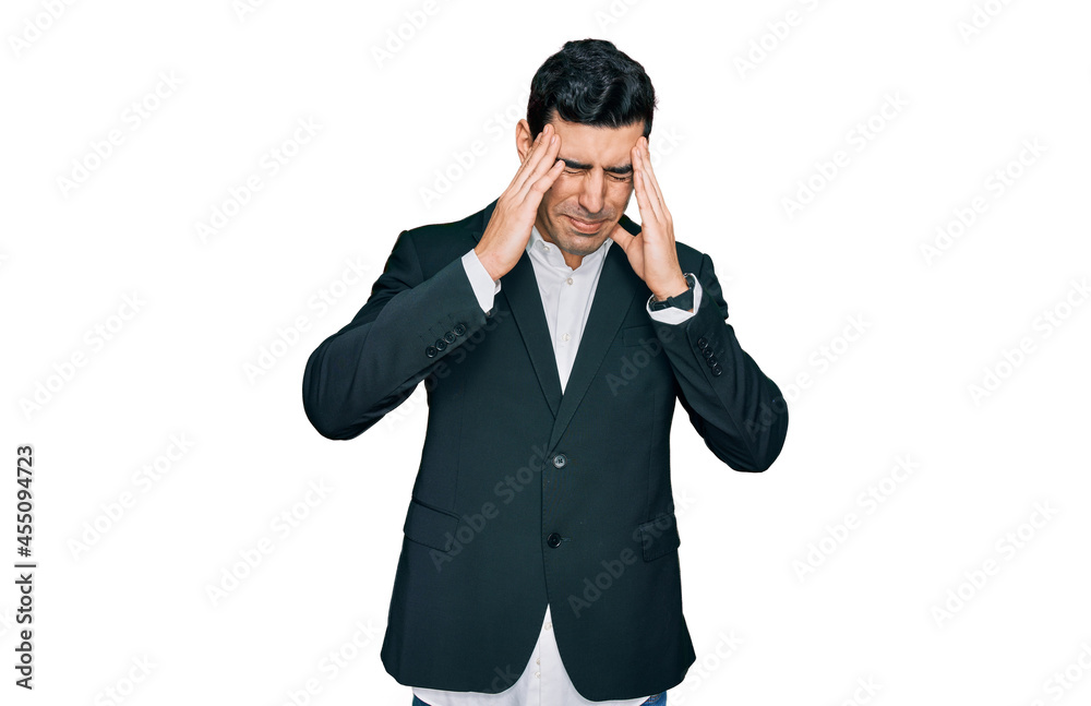 Handsome hispanic man wearing business clothes with hand on head, headache because stress. suffering migraine. Handsome hispanic man wearing business clothes with hand on head, headache because stress. suffering migraine.