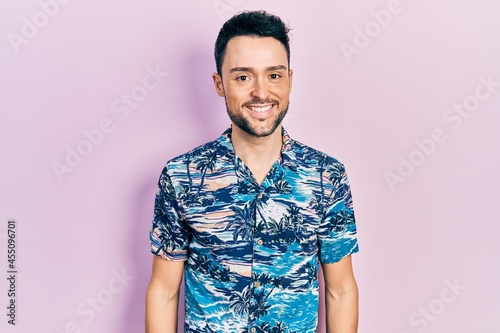 Wallpaper Mural Young hispanic man wearing casual clothes looking positive and happy standing and smiling with a confident smile showing teeth Torontodigital.ca