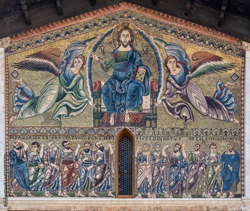 Closeup of religious images on the San Frediano Basilica in Lucca, Ita photo