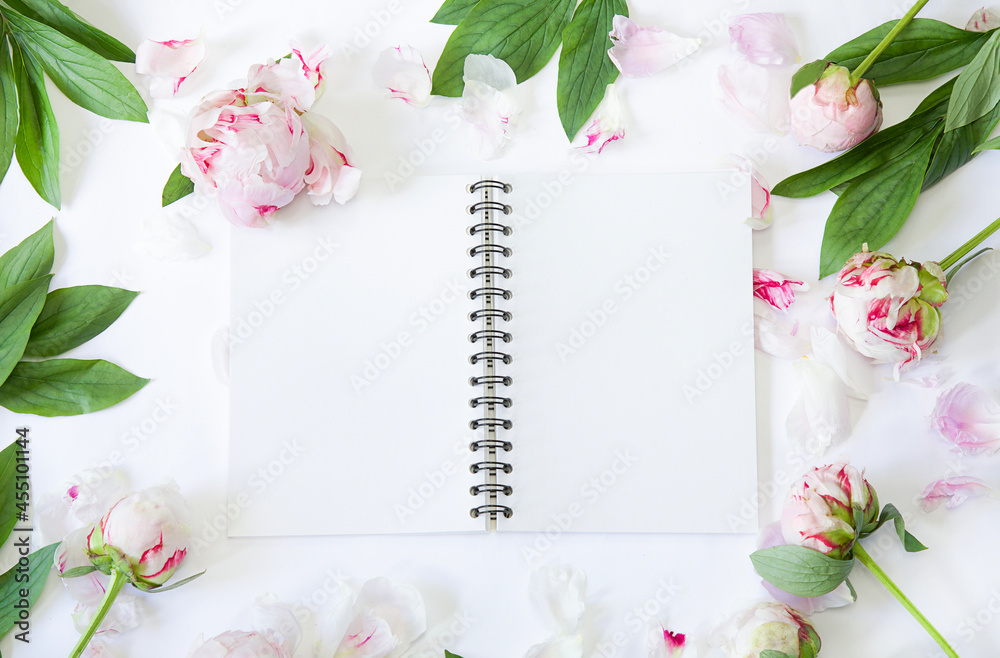 Floral flat lay. Peonies and bloc note. Mockup invitation. Floral flat lay. Peonies and bloc note. Mockup invitation.