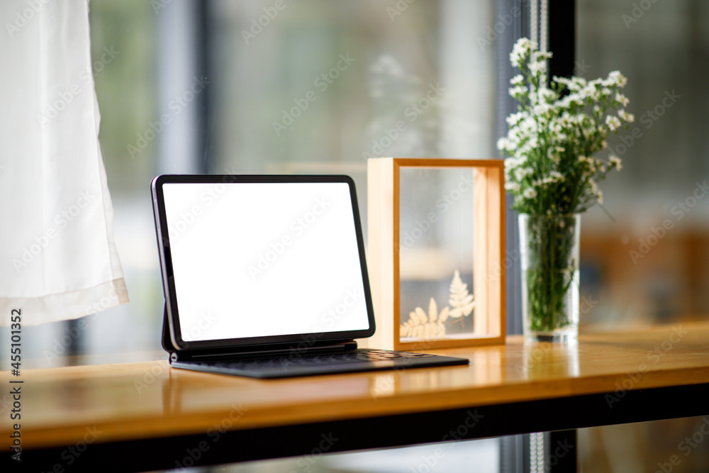 Fototapeta premium Stylish workspace with mockup tablet on table at workplace modern office.