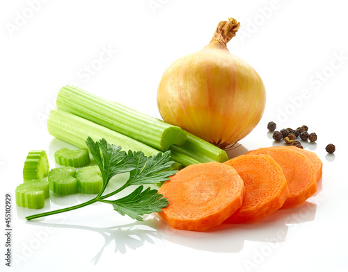 Celery sticks, carrot, black pepper, onion and parsley isolated on white