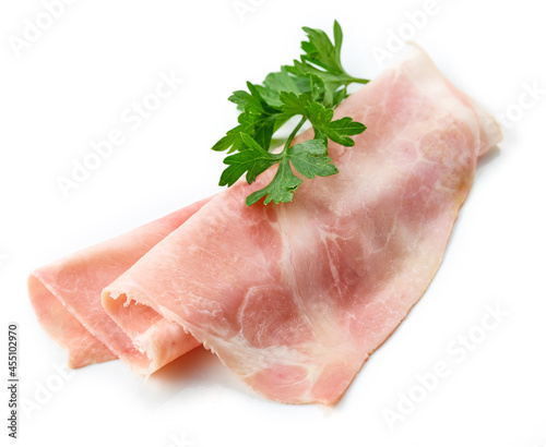 Prosciutto slices isolated on white