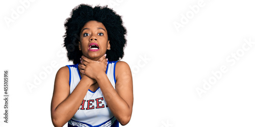Cuadro en lienzo Young african american woman wearing cheerleader uniform shouting and suffocate because painful strangle