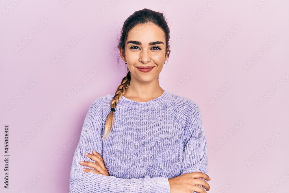 Young hispanic girl wearing casual clothes happy face smiling with crossed arms looking at the camera. positive person. Young hispanic girl wearing casual clothes happy face smiling with crossed arms looking at the camera. positive person.
