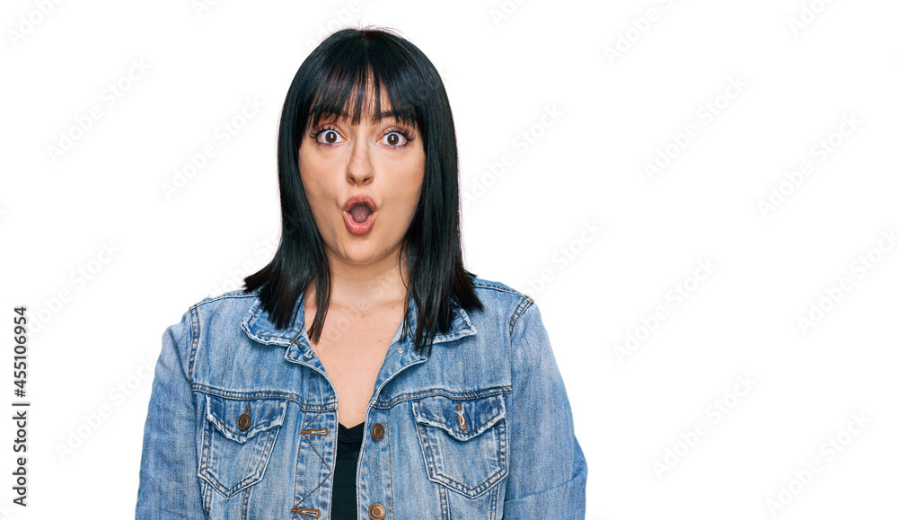 Young hispanic woman wearing casual clothes afraid and shocked with surprise expression, fear and excited face. Young hispanic woman wearing casual clothes afraid and shocked with surprise expression, fear and excited face.
