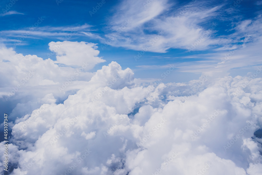 Aerial view of fluffy clouds and clear blue bright sky background in sunny day Aerial view of fluffy clouds and clear blue bright sky background in sunny day