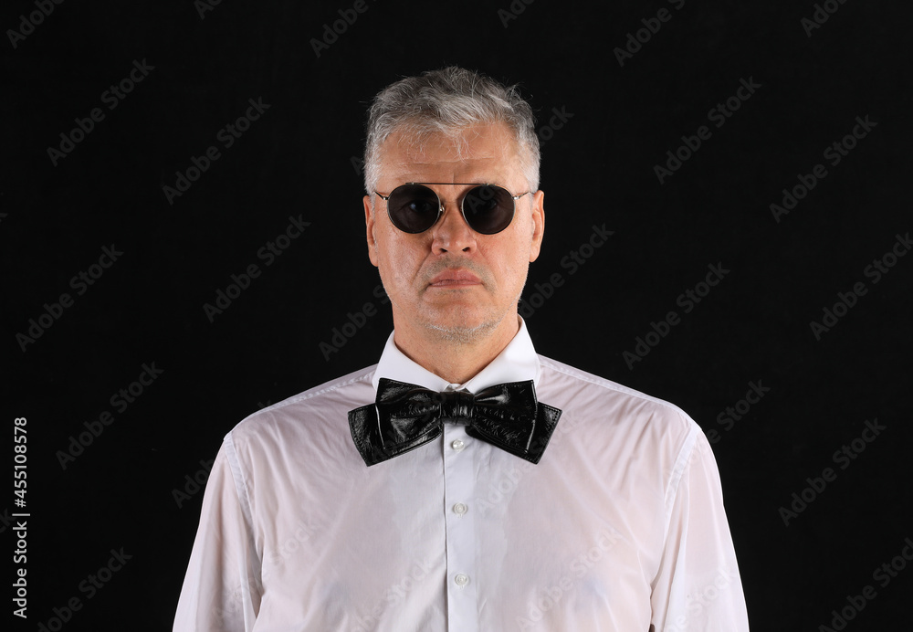 studio dark portrait of a gentleman on a black background studio dark portrait of a gentleman on a black background
