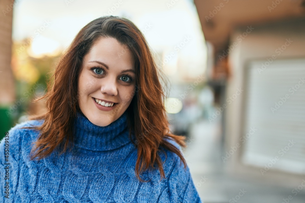 Young irish plus size girl smiling happy standing at the city. Young irish plus size girl smiling happy standing at the city.