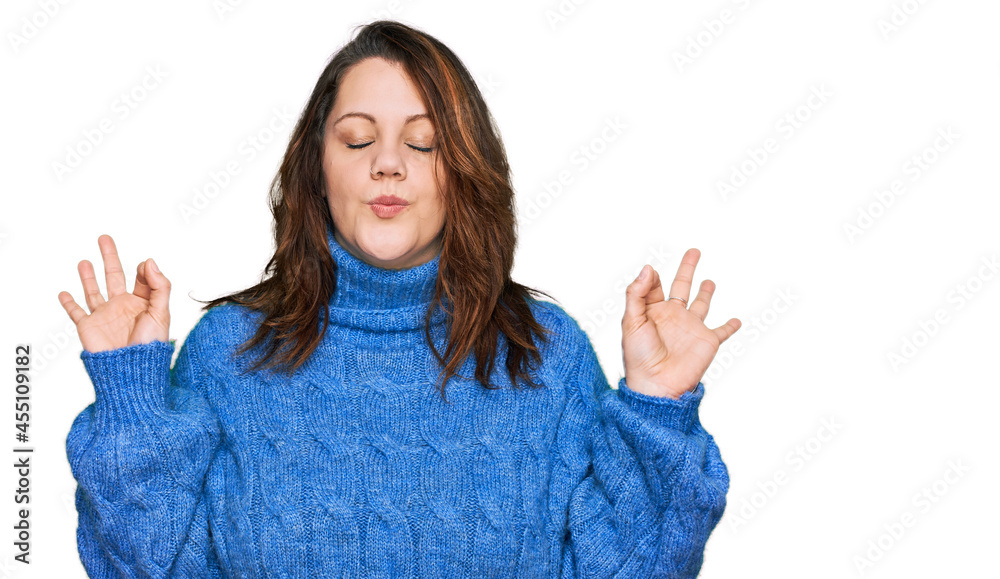Young plus size woman wearing casual clothes relax and smiling with eyes closed doing meditation gesture with fingers. yoga concept. Young plus size woman wearing casual clothes relax and smiling with eyes closed doing meditation gesture with fingers. yoga concept.