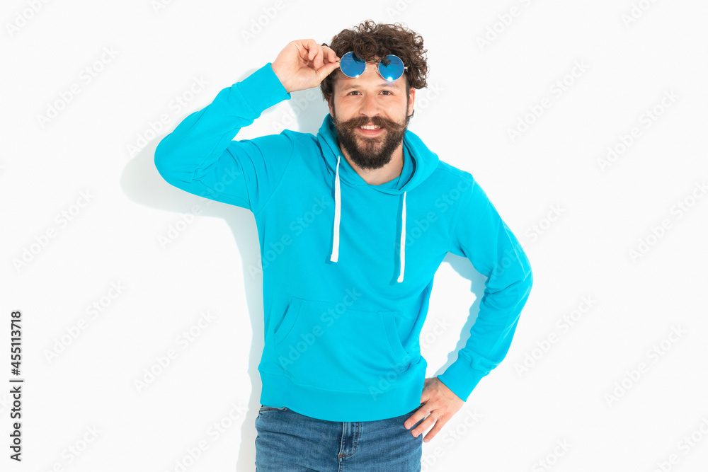 Fototapeta premium casual sexy guy moving his sunglasses on his forehead