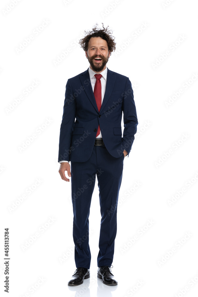 attractive businessman holding one hand in pocket and smiling attractive businessman holding one hand in pocket and smiling