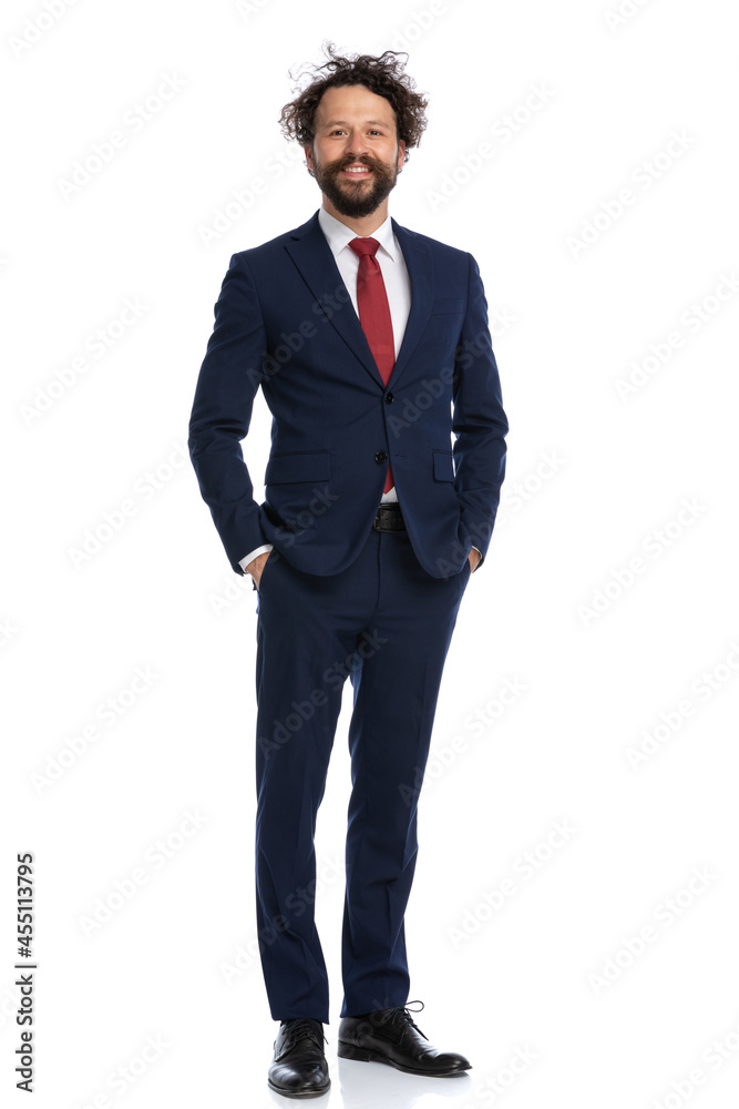 businessman holding his arms in pockets and smiling businessman holding his arms in pockets and smiling