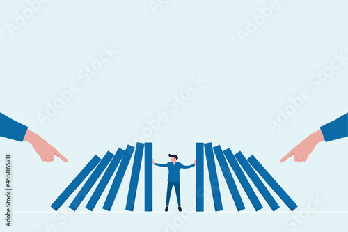 Businessman preventing domino effect in business concept. Business crisis management and solution concept. blocking