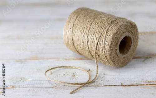 image of the rough, strong thread on a wooden table close-up
