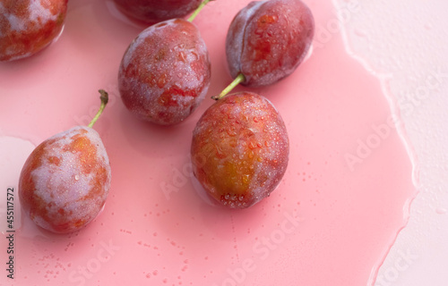 Plums with water drops on peels, photo