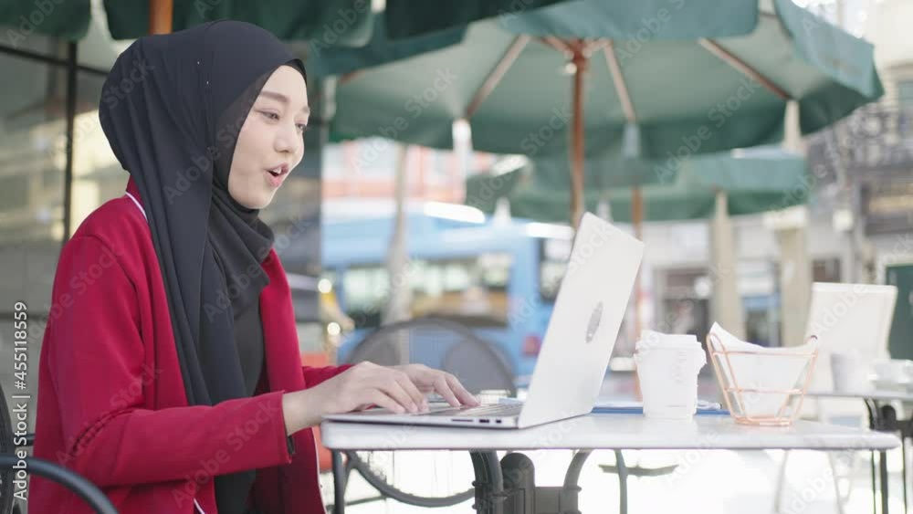 Muslim young women wear hijab using laptop video call and checking ...