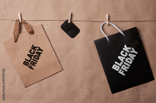 Black friday concept. Shopping bags on the rope