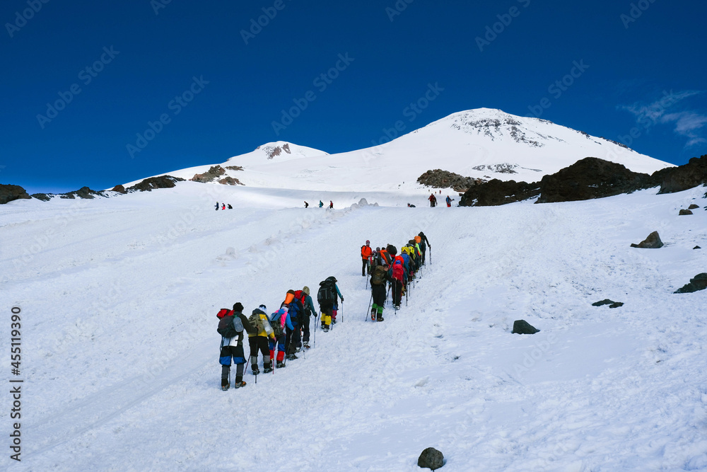Group of tourists on the way to the mountain Elbrus. Russia.