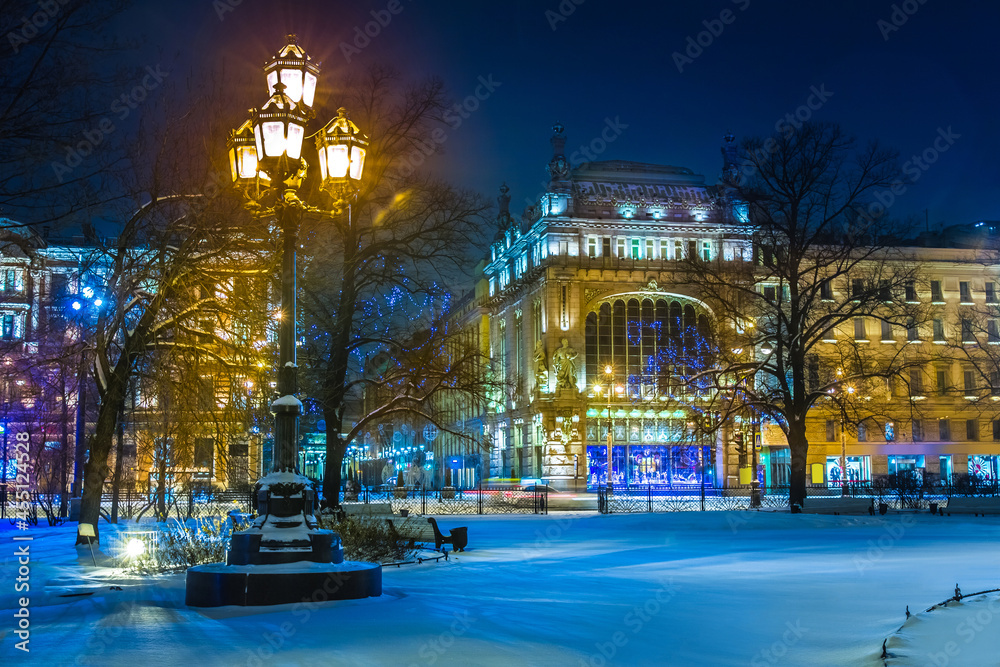 Saint Petersburg. Russia. Winter evening in St. Petersburg. Nevsky prospect. Ostrovsky square is lit by lanterns. Eliseevsky shop. Lights of the evening city. Winter trip to Russia.