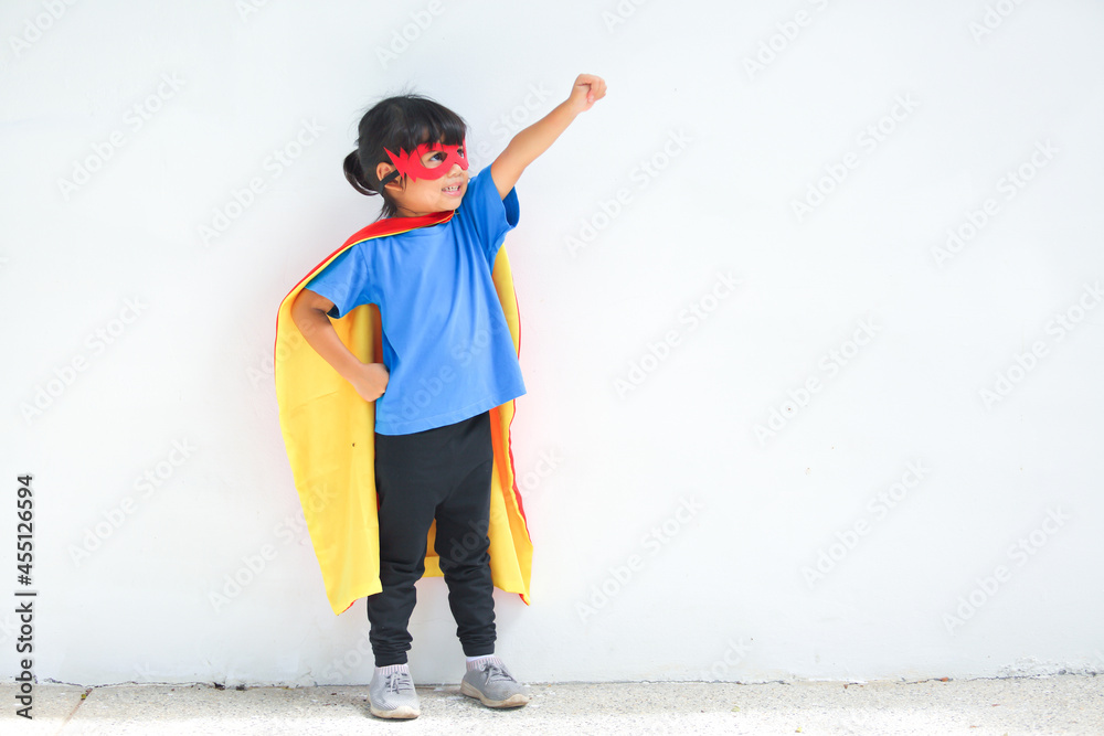 Earth day concept. A cute little girl joy and childhood have confidence  action with dressed and wearing mask and cape of superhero kid.Children  dream and imagination. Stock Photo | Adobe Stock