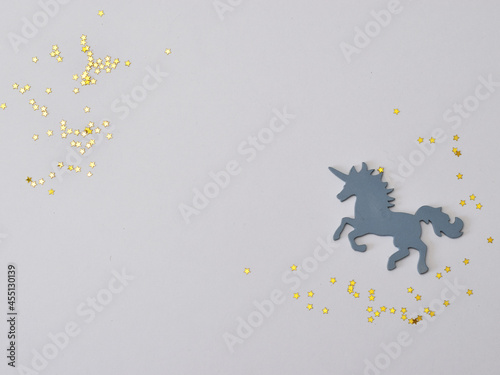 Top view of large colorful, decorative unicorn. The concept of children's holidays. Minimal Flat lay.