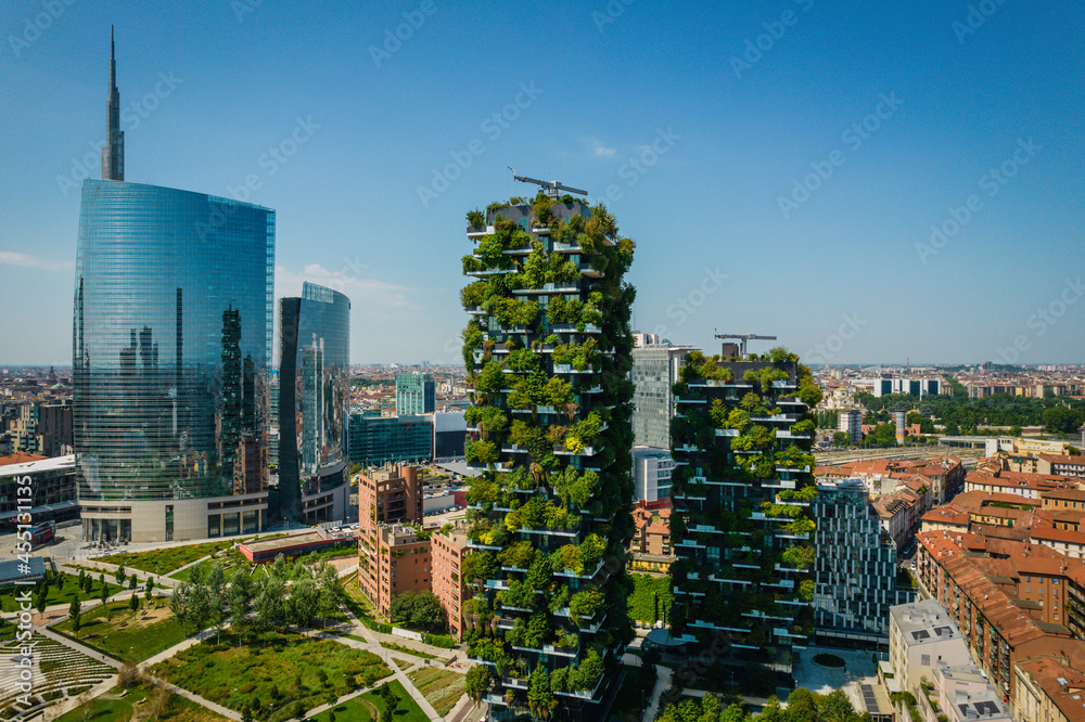 Fototapeta premium Aerial photo of Bosco Verticale, Vertical Forest, in Milan, Porta Nuova district. Residential buildings with many trees and other plants in balconies