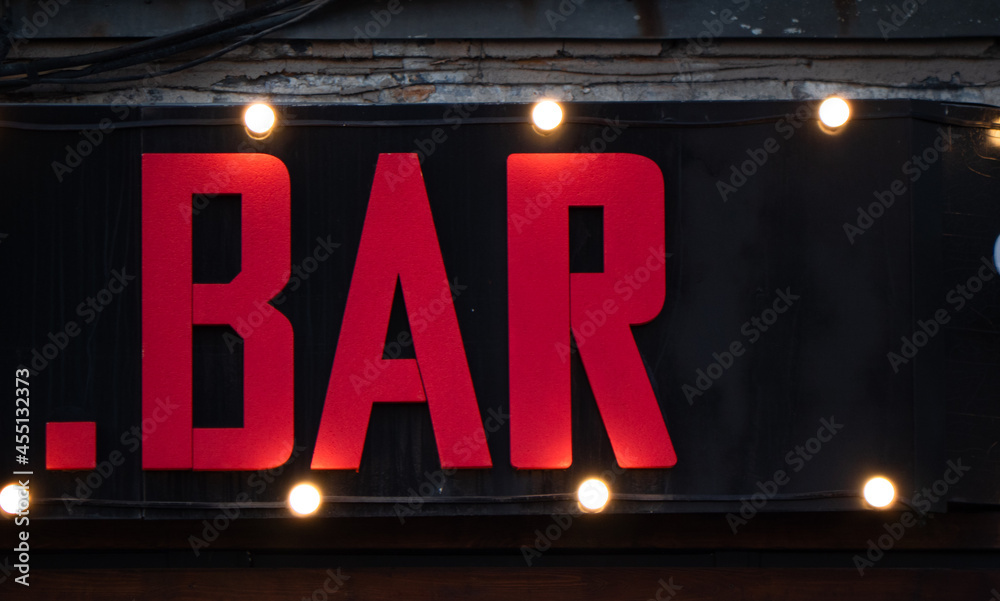 red bar sign, illuminated by lanterns. night red bar sign, illuminated by lanterns. night