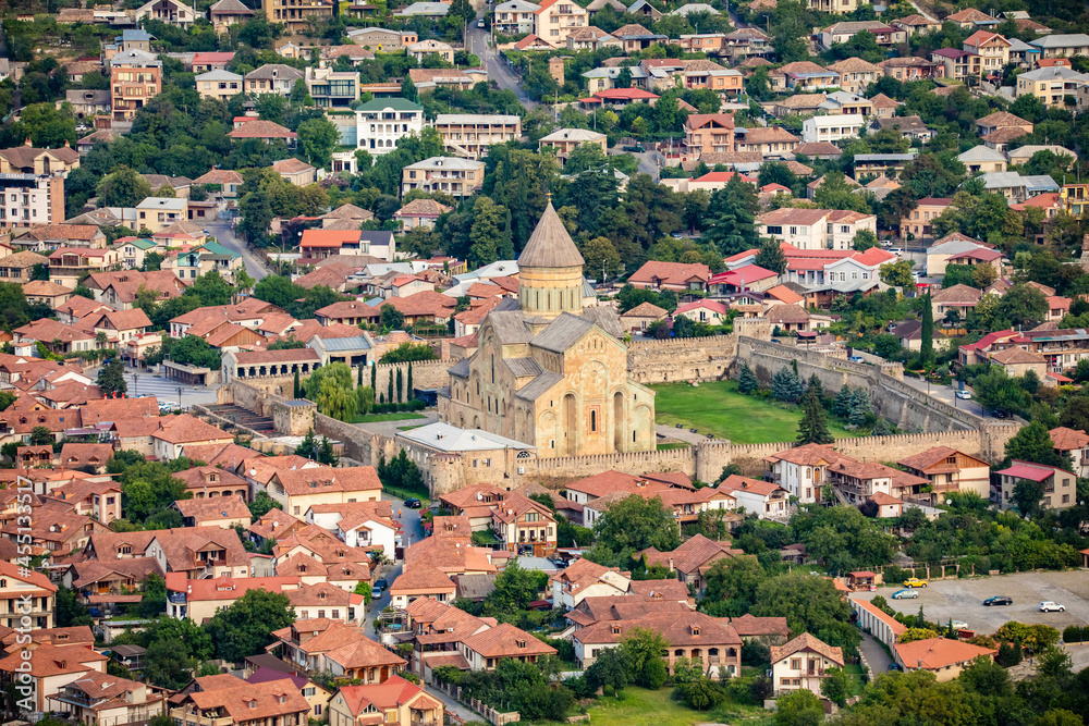 Beautiful view of streets of Mtskheta village in Georgia with Svetitskhoveli Cathedral fortress