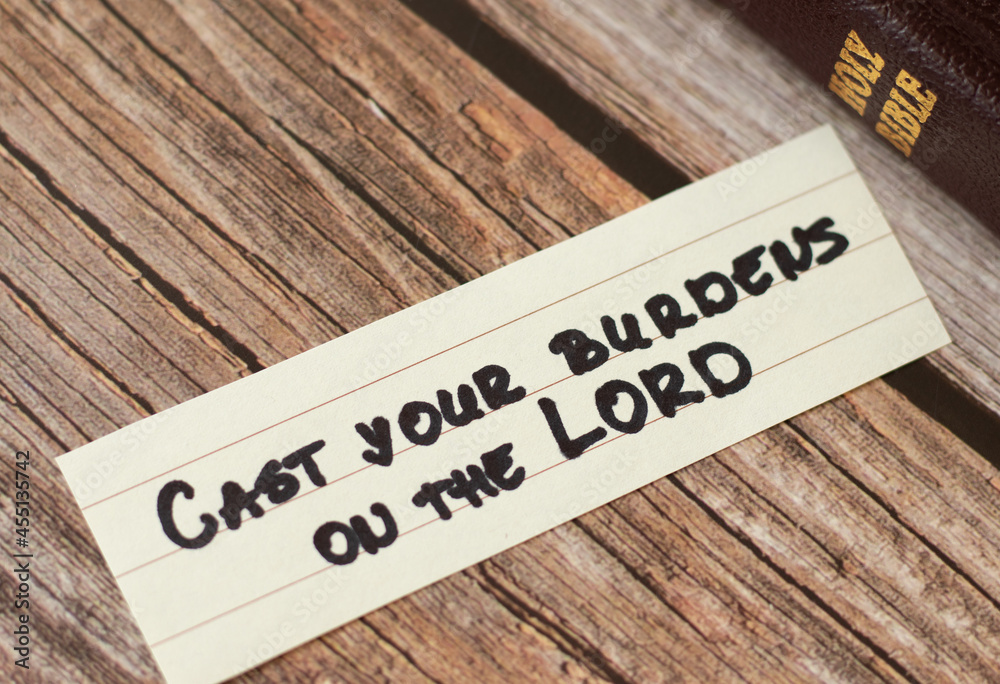 Cast your burdens, cares, troubles on the LORD. The biblical concept of faith and trust in God Jesus Christ. A handwritten inspiring quote from Holy Bible. Christian hope, believe, comfort. A close up Cast your burdens, cares, troubles on the LORD. The biblical concept of faith and trust in God Jesus Christ. A handwritten inspiring quote from Holy Bible. Christian hope, believe, comfort. A close up