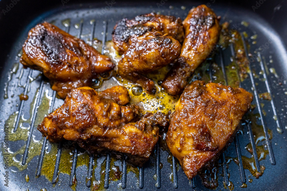 Indonesian Traditional Chicken Grilled on Top of Skillet