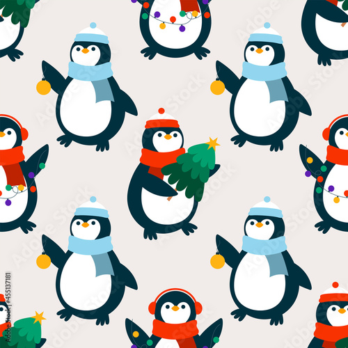 Penguins with Christmas tree  garland  and ball.